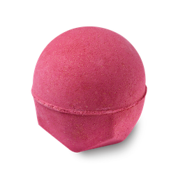 I Love To Read A Good Bit Of Poetry Whilst I'm In The Bath | Lush Bathing In Poetry Range | Gifted A large dark red rounded hexagonal shaped bath bomb that has some gold lustre all over it, on a white background.