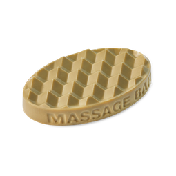 A medium light green oval shaped block of solid massage oil that has a layer of Magnesium Salt Crystals embedded on the top of it, on a white background.