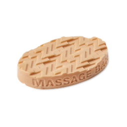 A medium light purple oval shaped block of solid massage oil that has a layer of Magnesium Salt Crystals embedded on the top of it, on a white background.