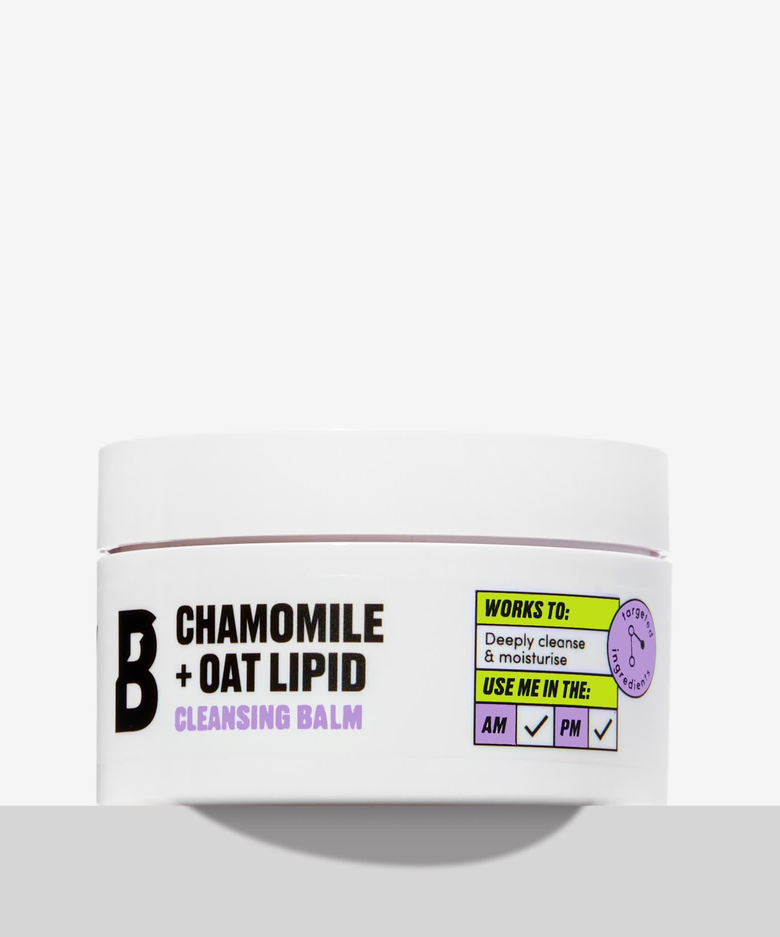 Cleansing My Face Is Always The First Step In My Beauty Routine | By Beauty Bay Chamomile + Oat Lipid Cleansing Balm A short cylindrical white plastic tub with a white label that has By Beauty Bay written in bold black writing, Chamomile + Oat Lipid Cleansing Balm written in dark purple writing, and a picture of a black letter B on it, on a white background.