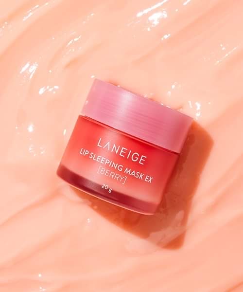 Awoken By True Love's First Kiss | Laneige Berry Lip Sleeping Mask A short cylindrical clear plastic jar full of some bright pink liquid with a bright pink plastic lid that has Laneige Berry Lip Sleeping Mask written in bright white writing on it, on a white background.