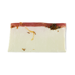 A large bright red and white rectangular block block of soap, on a white background.