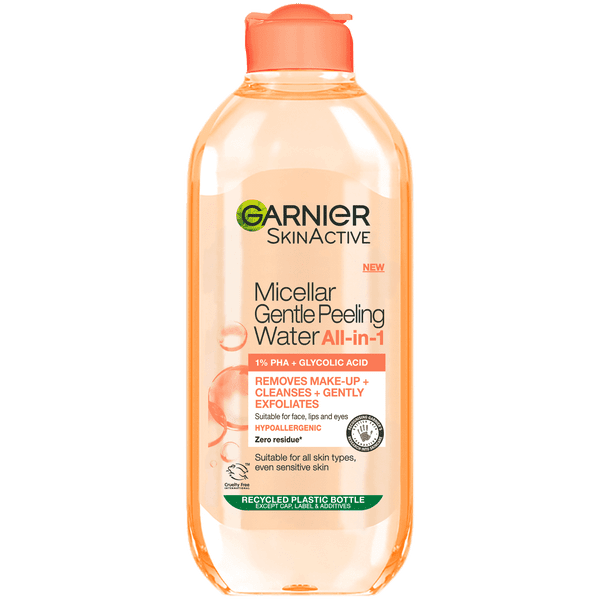 Gently Peeling Dead Skin Away Every Day | Garnier SkinActive Micellar Gentle Peeling Water | Gifted A tall rounded rectangular bright peachy pink plastic bottle with a bright peachy pink plastic lid that has Garnier SkinActive written in bold black writing and Micellar Gentle Peeling Water written in dark pink writing on it, on a white background.