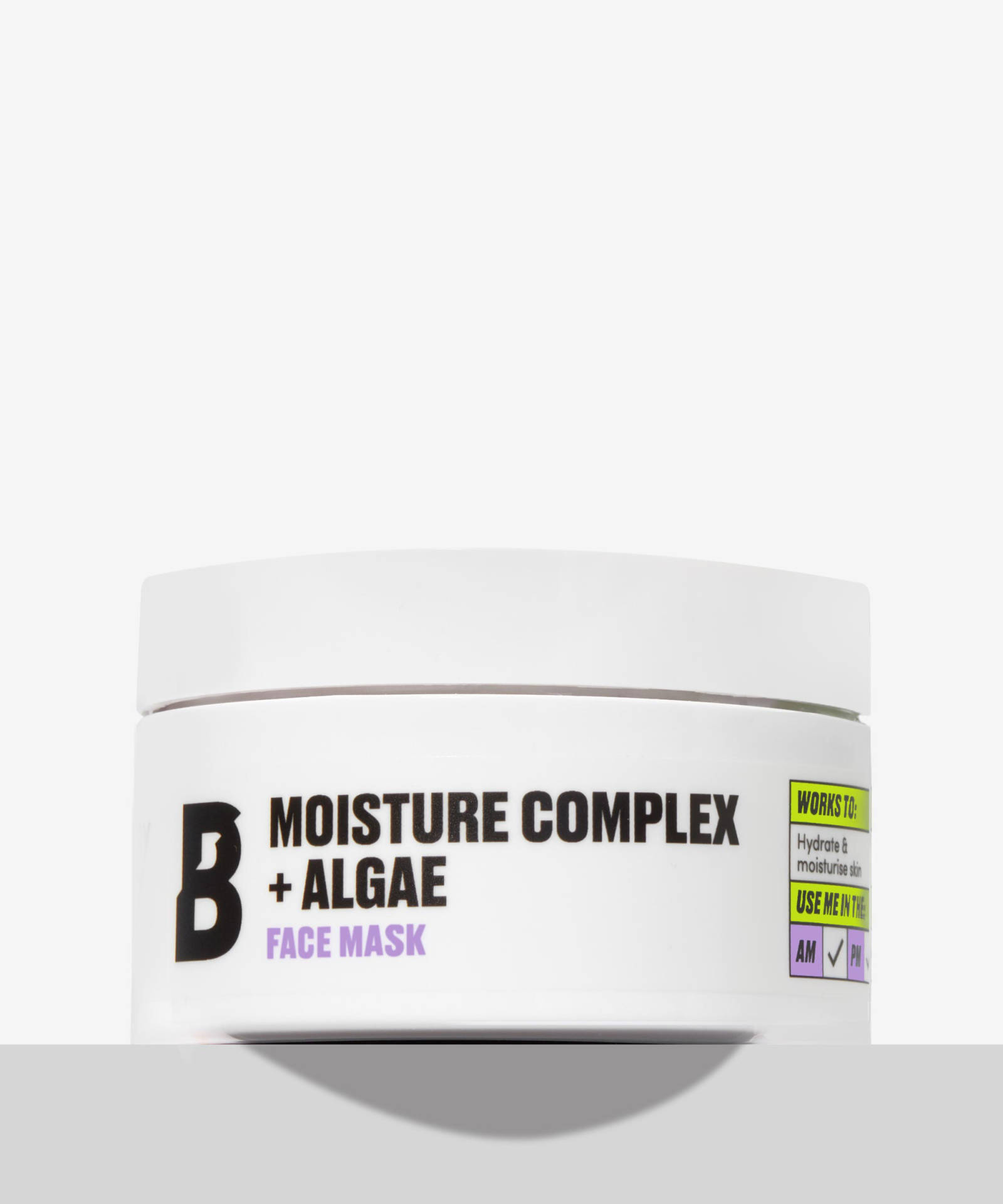 My Skin’s Moisture Levels Are A Complex Beast | By Beauty Bay Moisture Complex + Algae Face Mask A short cylindrical white Plastic Tub with a white Plastic Lid that has By Beauty Bay Moisture Complex + Algae written in bold black writing and Face Mask written in dark purple writing on it, on a white background.