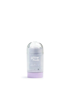 A tall cylindrical clear plastic twist up tube with a light purple dial and a clear frosted label that has Glow Hub Purify & Brighten Face Mask Stick written in bright white writing on it, on a white background.