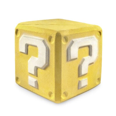 Yeah We Can all Level Up | Lush X Super Mario Bros. Movie Range A large golden yellow cube shaped bath bomb that has a bright white question mark engraved on it, on a white background.