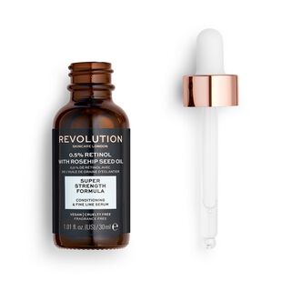 A short cylindrical brown glass bottle with a gold and white Rubber Pipette Lid and a black label that has Revolution Skincare 0.5% Retinol & Rosehip Seed Oil Smoothing Serum written in bright white writing on it, on a white background.