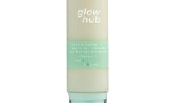 A tall cylindrical dome shaped clear plastic bottle full of some creamy white liquid with a clear plastic lid and a bright green label that has Glow Hub Calm & Soothe Gel To Oil Cleanser written in bright white writing on it, on a white background.