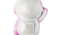 A bright white astronaut shaped Bath Bomb that has some patches of bright blue, some patches of bright pink, and some silver lustre all over it, on a white background.