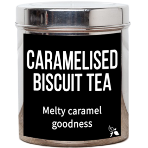 A short cylindrical silver metal tin with a black label that has bird & blend tea company Caramelised Biscuit Loose Leaf Tea written in bold white writing on it, on a white background.