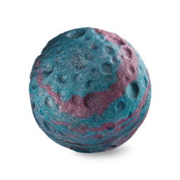Breaking Through The Atmosphere | Lush X Asteroid City Range A medium metallic purple spherical asteroid shaped bath bomb that has some bright blue swirls and some silver lustre all over it, on a white background.