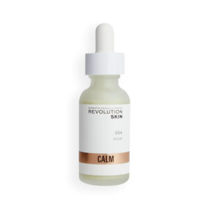 A short cylindrical clear glass bottle full of some dark green liquid with a white rubber pipette lid and a white label that has Revolution Skincare written in bright silver writing and Cica Serum written in bold black writing on it, on a white background.