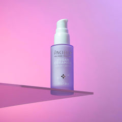 I Need A Pacific Kind Of Skincare To Calm My Skin Down | Pacifica Vegan Ceramide Barrier Range A short cylindrical clear Glass Bottle full of some pale purple liquid with a white Rubber Pipette Lid and a white label that has Pacifica Vegan Ceramide Barrier Serum written in bold black writing on it, on a white background.