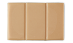 A medium creamy beige rectangular chocolate bar shaped block of solid sun cream oil, on a white background.