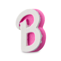 I'm A Barbie Girl, In A Barbie World | Lush x Barbie™ Range A large bright pink cursive letter B shaped Bath Bomb that has a large bright white cursive Letter B engraved on it, on a white background.