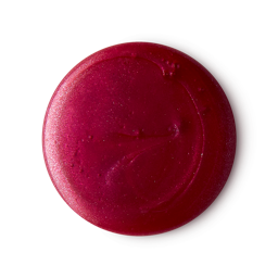 A medium circular puddle of some bright neon Pink Shampoo that has some pieces of Silver Lustre running through it, on a white background.