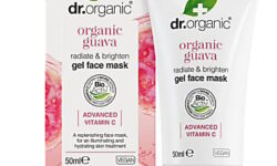 A short conical bright white plastic tube with a clear plastic lid that has Dr. Organic written in bright pink writing and Guava Face Mask written in bold black writing on it, on a white background.