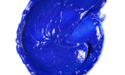 A medium circular puddle of some bright neon purple conditioner, on a white background.