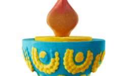 A medium cylindrical bright Blue Candle shaped Bath Bomb that has a bright yellow centre and a dark rusty Red flame shaped bath melt coming out of the top of it, on a white background.