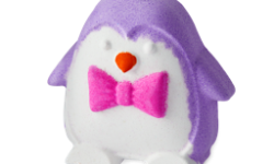 A large bright purple penguin shaped bath bomb that has a bright white belly and a bright pink bow tie engraved on it, on a white background.