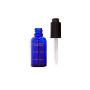A short cylindrical clear glass bottle full of some dark blue liquid with a black Plastic Pipette Lid and a white label that has Revolution Skincare Overnight Recovery Concentrate written in bright gold writing on it, on a white backhground.
