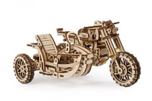 A large 3 wheeled bronze metal motorbike ornament, on a white background.