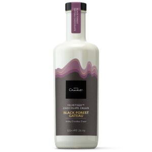 A tall cylindrical bright white glass bottle with a dark purple plastic Lid and a black label that has Hotel Chocolat Black Forest Gateaux Velvetised Cream written in bright white writing and some pictures of some dark purple waves on it, on a white background.
