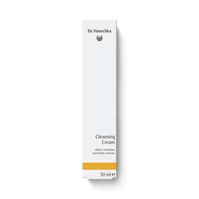 Maybe The Doctor Can Help Me Get Cleansed & Hydrated Skin | Dr. Hauschka Cleansing Cream A tall rectangular bright white cardboard box that has Dr. Hauschka Cleansing Cream written in bold black writing on it and a picture of a bright yellow stripe on it, on a white background.