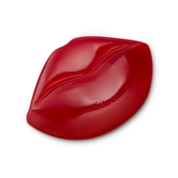 Because Tonight I’m Gonna Give You My, Mwah! Mwah! | Lush Valentine's Day 2024 Range A medium bright red puckered lips shaped block of Shower Jelly, on a white background.