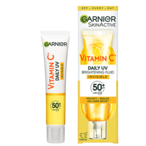 A tall conical bright white plastic tube with a bright yellow plastic lid and a bright yellow label that has Garnier SkinActive Vitamin C Daily Brightening UV Fluid Invisible SPF50+ written in bold black writing on it next to a tall rectangular gradient bright white and yellow cardboard box that has Garnier SkinActive Vitamin C Daily Brightening Fluid Invisible SPF50+ written in bold black writing and some pictures of some slices of some bright yellow Lemons on it, on a white background.