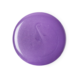 A medium circular puddle of some bright purple shower gel that has some pieces of silver lustre running through it, on a white background.