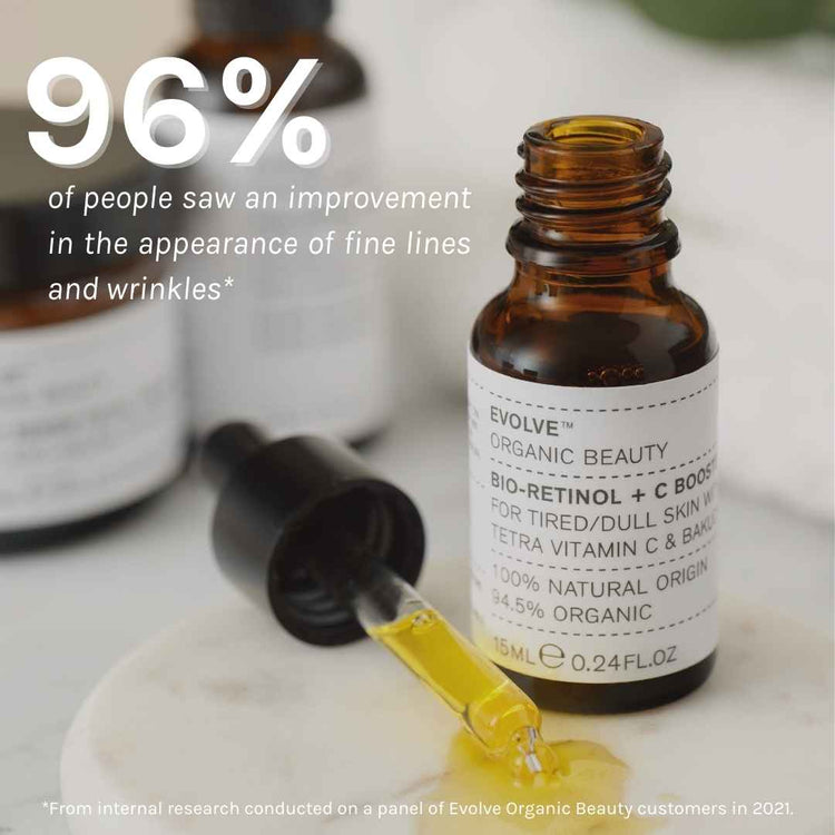 My Skin Is Constantly Evolving | Evolve Organic Beauty Bio-Retinol + C Skin Booster A short cylindrical amber Glass Bottle with a black Rubber Pipette Lid and a white label that has Evolve Organic Beauty Bio-Retinol + C Skin Booster written in bold black writing on it, on a white background.