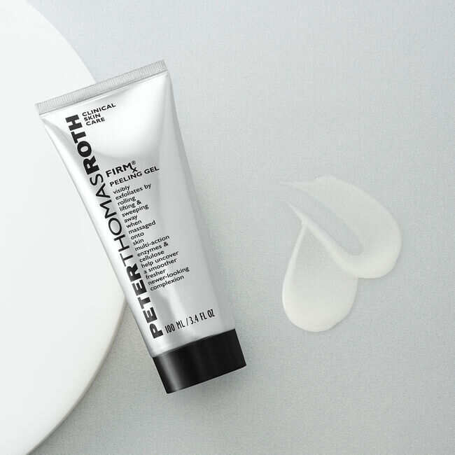 - [ ] A tall conical bright silver plastic Tube with a black plastic lid that has Peter Thomas Roth written in bright silver writing and FIRMx® Peeling Gel written in bold black writing on it next to a medium circular puddle of some translucent white liquid, on a white background.