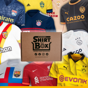 A medium rectangular cardboard box surrounded by a collection of various different coloured football shirts that all have various different coloured logos on them, on a white background.