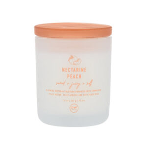A tall cylindrical clear Glass Jar full of some creamy white wax with a bright peach glass lid and a bright white label that has DW Home Candles Nectarine Peach written in bright peach writing on it, on a white background.
