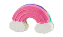 A medium bright pink, orange, blue, green and purple rainbow shaped bath bomb that has some fluffy white clouds engraved on it, on a white background.