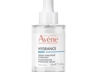A short cylindrical clear glass bottle full of some clear liquid with a bright white rubber pipette lid and a bright white label that has Avène written in bright red writing, Hydrance Boost written in dark blue writing, and Serum written in bold black writing on it, on a white background.