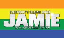 A poster that has everybody’s talking about Jamie written in bright white writing on a multicoloured rainbow background that includes, red, orange, yellow, green, blue and purple.