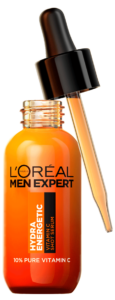 A short rounded cylindrical bright orange glass bottle with a black rubber pipette lid and a bright orange label that has L’Oreal Paris Men Expert Vitamin C Shot Serum written in bold black writing and Hydra Energetic written in bright white writing on it, on a white background.