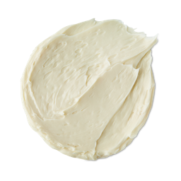Sunshine, Lollipops and Rainbows, That’s Everything That’s Wonderful When We’re Together | Lush Suncare 2024 Range A medium circular puddle of some creamy ivory Facial sunscreen, on a white background.