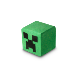 A medium bright green cube shaped bath bomb that has some black squares engraved all over it, on a white background.