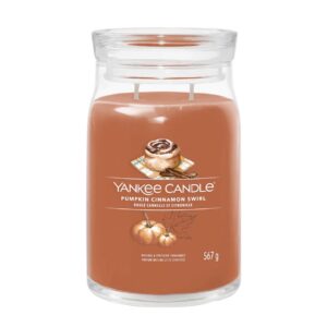 A tall cylindrical glass jar full of some dark pumpkin orange wax with a label that has Yankee Candle written in bright white writing, Pumpkin Cinnamon Swirl written in bright white writing, and a picture of a golden brown cinnamon roll on top of a blue and white checkered napkin next to some dark brown cinnamon sticks on it, on a white background.