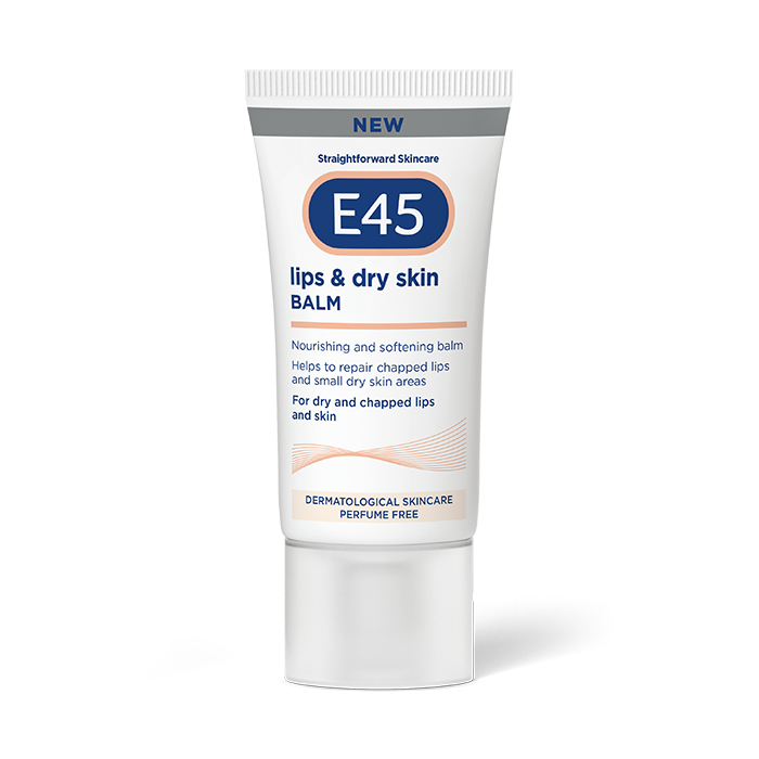 Help! I Have A Dry Skin Emergency | E45 Lips & Dry Skin Balm A short flat conical bright white plastic tube with a clear plastic lid that has E45 written in bright white writing, Lips & Dry Skin Balm written in dark blue writing, a picture of a dark blue oval, and a picture of a dark grey stripe on it, on a white background.