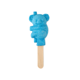A large electric blue koala shaped bubble bar that has some silver lustre all over it on the end of a light wooden stick, on a white background.