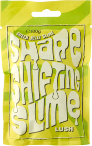 A medium rectangular gradient bright green and yellow paper pouch that has Lush Shape Shifting Slime Green Jelly Slime written in bright white writing on it, on a white background.
