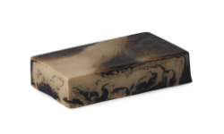 A medium gradient light and dark brown rectangular shaped block of soap that has a swirl pattern all over it, on a white background.
