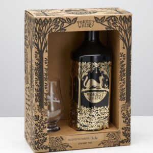 A tall cylindrical black glass Whiskey Bottle with a black metallic lid and a gold label that has The Forest Distillery 70cl 26 Whiskey written in bold black writing, a picture of a Squirrel, and a picture of some dark green trees on it next to a short cylindrical whiskey glass that has a forest design engraved on it, and a tall rectangular brown cardboard box that has The Forest Distillery 70cl Forest Whiskey Gift Set written in bold black writing and some pictures of some black trees and leaves on it, on a white background.