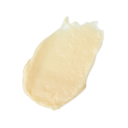 A medium circular puddle of some thick creamy white face wash, on a white background.