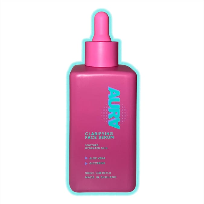 A tall rectangular bright pink glass bottle with a bright pink rubber pipette lid that has Aura Clarifying Face Serum written in bright turquoise writing on it, on a white background.