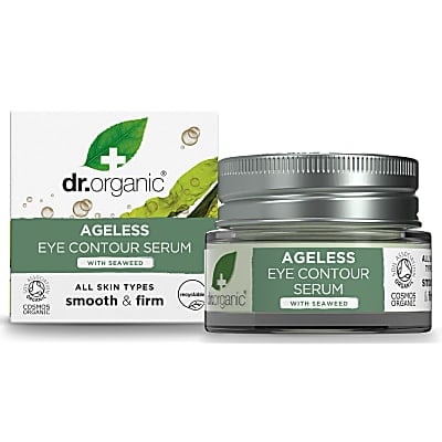 A short cylindrical glass jar with a metallic silver lid and a light green label that has Dr. Organic Seaweed Ageless Eye Contour Serum written in bright white writing and a picture of a dark green leaf with a white cross over it next to a short square pale green cardboard box that has Dr. Organic Seaweed Ageless Eye Contour Serum written in bright white writing on it, on a white background.
